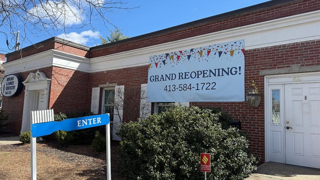 Side view with grand reopening sign