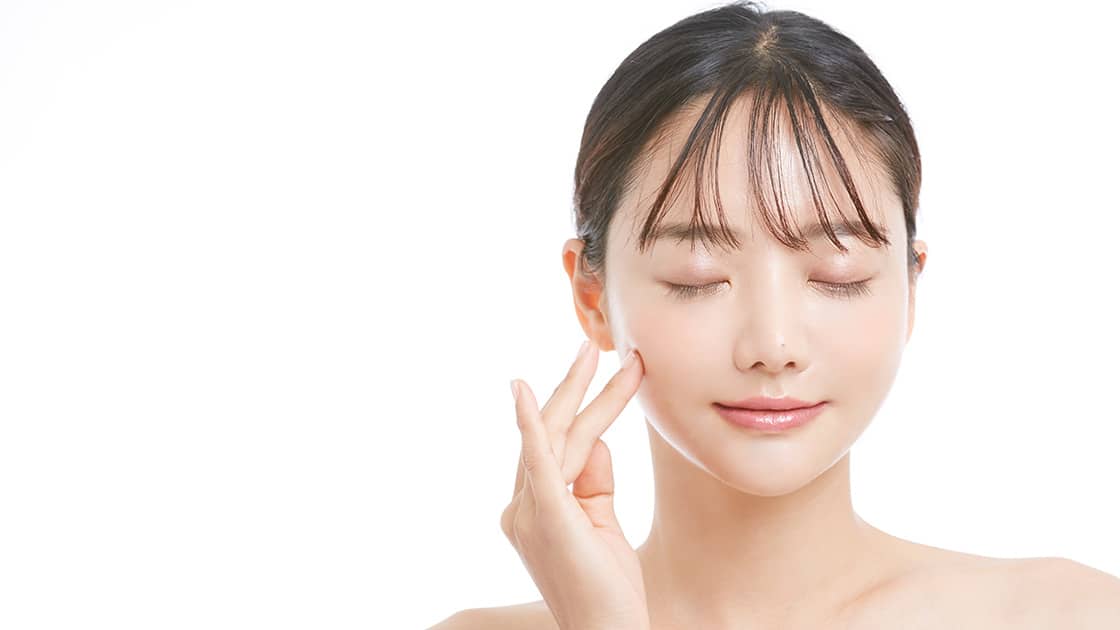 Woman Touching Jaw - Occlusal Adjustment